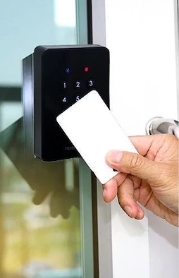 person pressing number buttons on an access control system installed by Armory Locksmiths